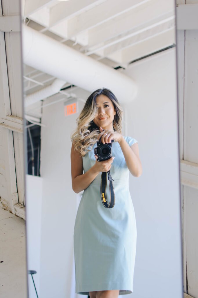 Arizona blogger, Demi Bang, taking a selfie in a mint dress from Ann Taylor.