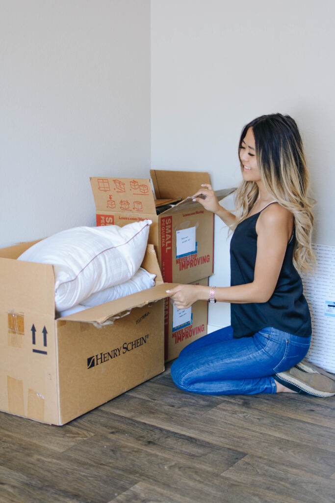 Demi Bang, an Arizona lifestyle blogger, packing things to move out of her apartment.