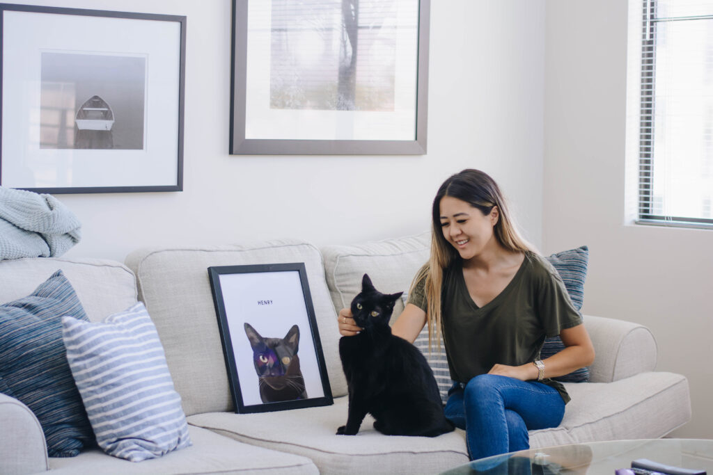 Arizona blogger, Demi Bang, with her Bombay cat Henry and a custom pet portrait.
