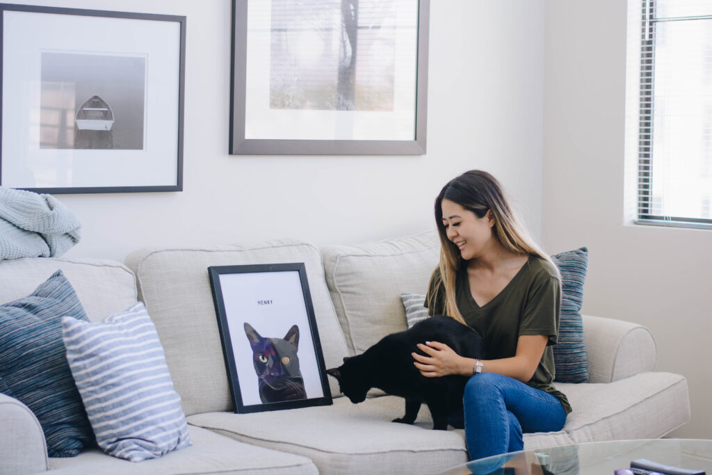 Arizona blogger, Demi Bang, with her Bombay cat Henry and a custom pet portrait.