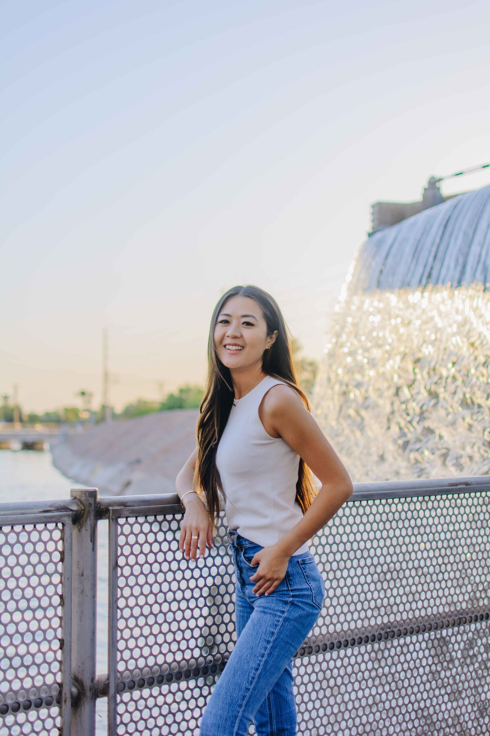 Demi Bang standing in front of the Arizona Falls in Phoenix, Arizona.