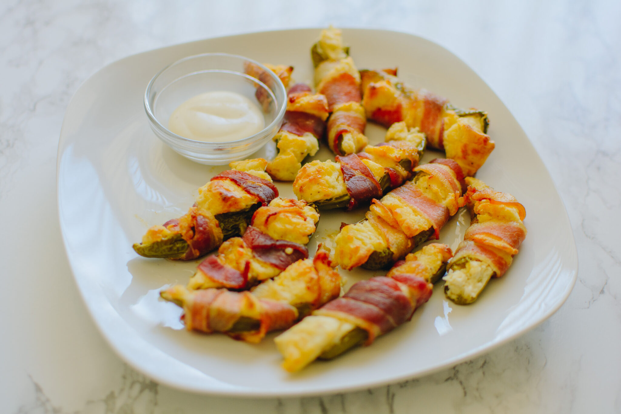 Cooking bacon-wrapped jalapeño poppers with Arizona blogger Demi Bang.