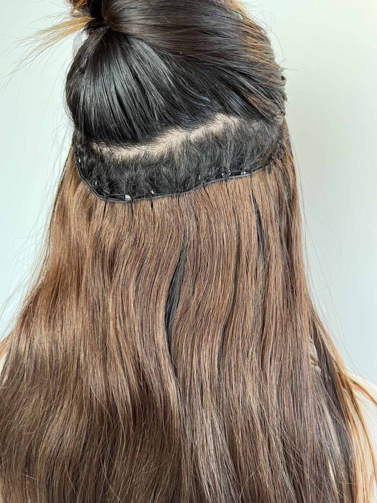 Arizona blogger Demi Bang shows a close up photo of her 6-weeks grown out hair extensions.