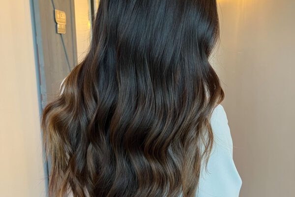 Arizona influencer Demi Bang shares the process of getting hand-tied weft hair extensions.