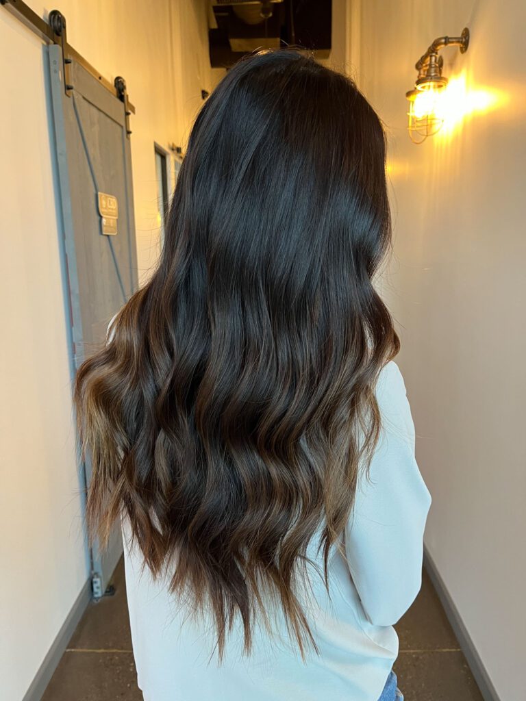 Arizona influencer Demi Bang shares the process of getting hand-tied weft hair extensions.
