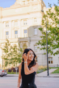Blogger Demi Bang in front of the Polk County Historic Courthouse in Iowa.