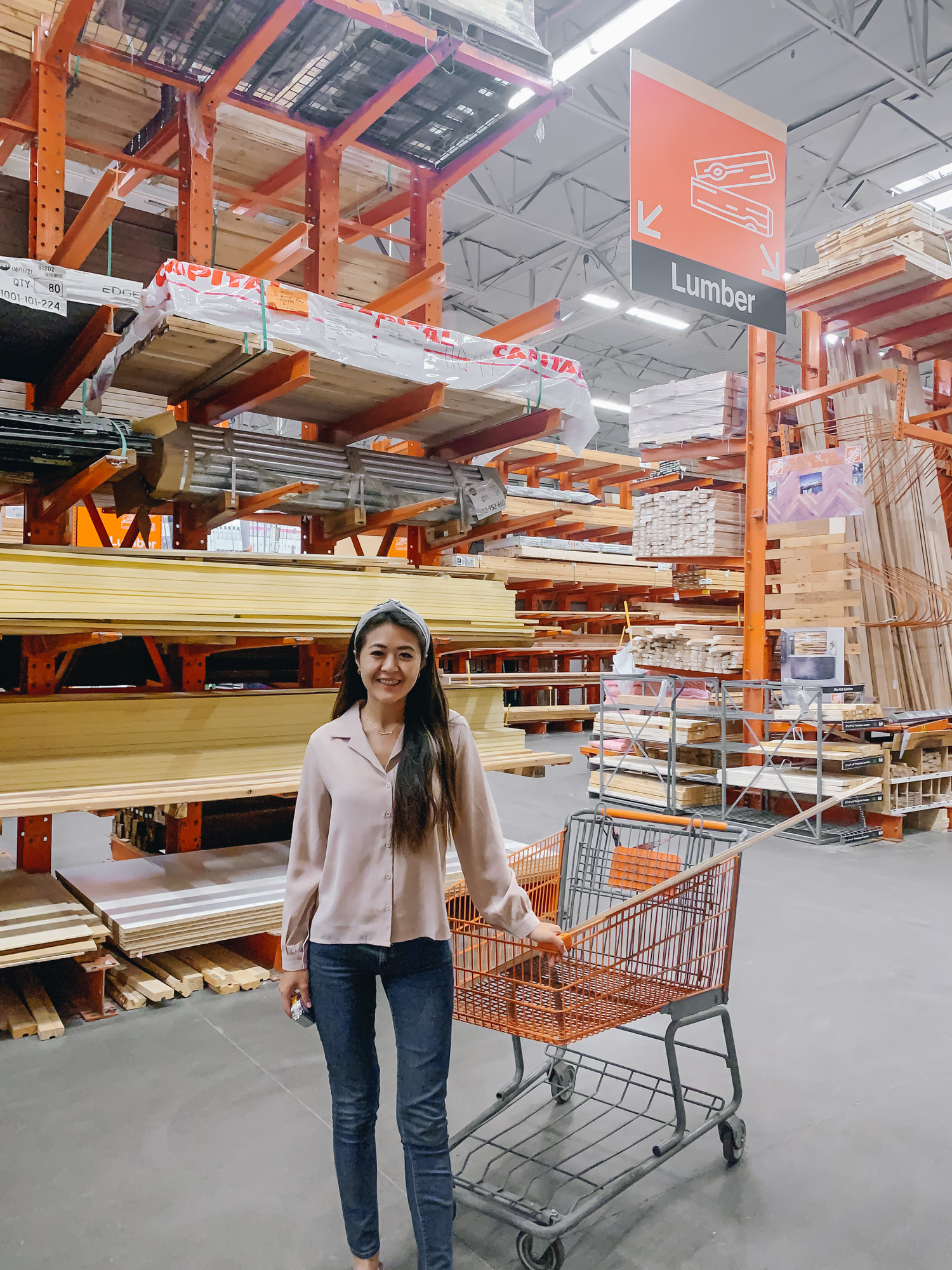 Blogger Demi Bang goes to Home Depot store to purchase wood for woodworking.