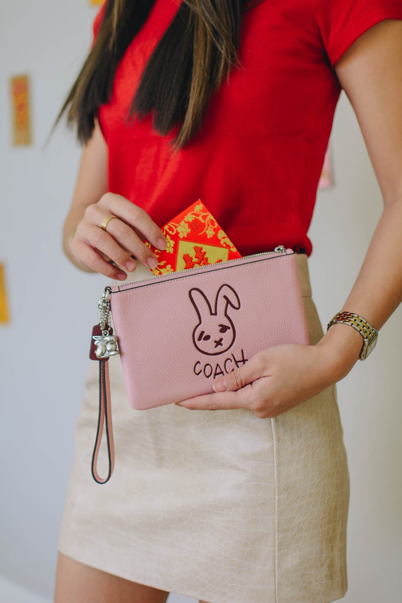 Demi Bang gives a limited-edition rabbit Coach wristlet for Lunar New Year. 