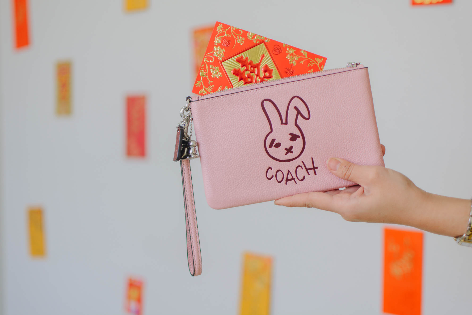 Demi Bang hosts a giveaway with Scottsdale Fashion Square to gift a limited-edition rabbit Coach wristlet for Lunar New Year.