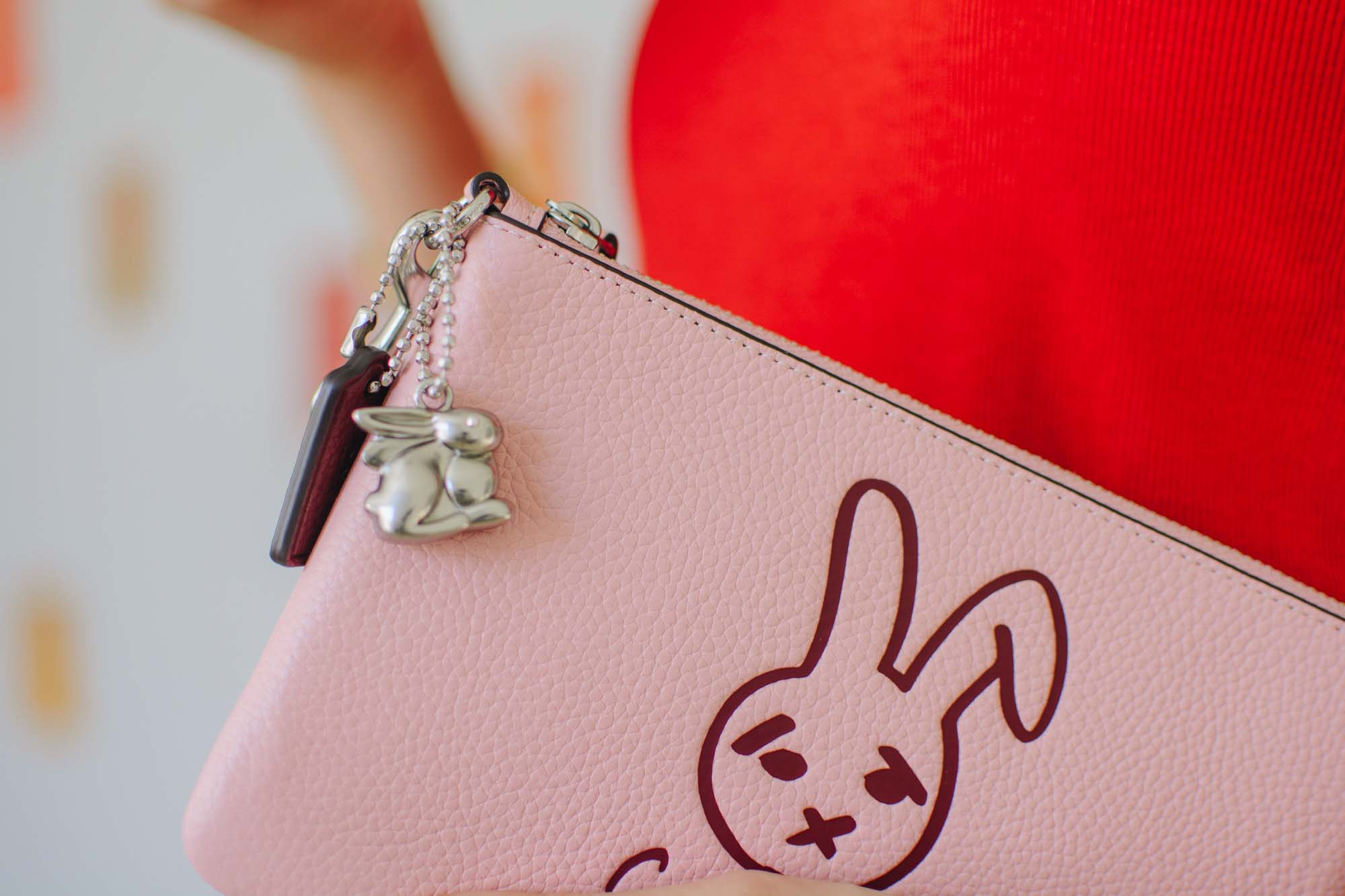 Scottsdale Fashion Square is gifting a 2023 Year of the Rabbit Wristlet from Coach's Lunar New Year collection.