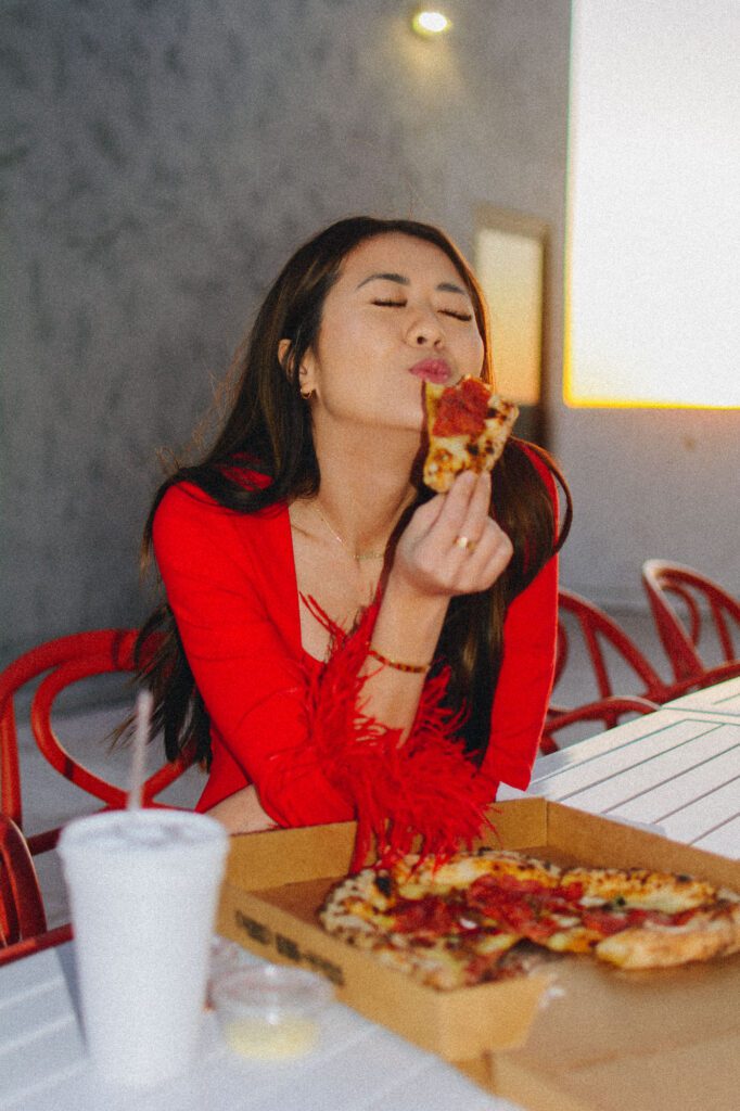 Arizona blogger Demi Bang eats pizza for National Pizza Day.