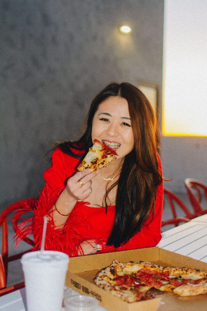 Arizona blogger Demi Bang eats pizza for National Pizza Day.