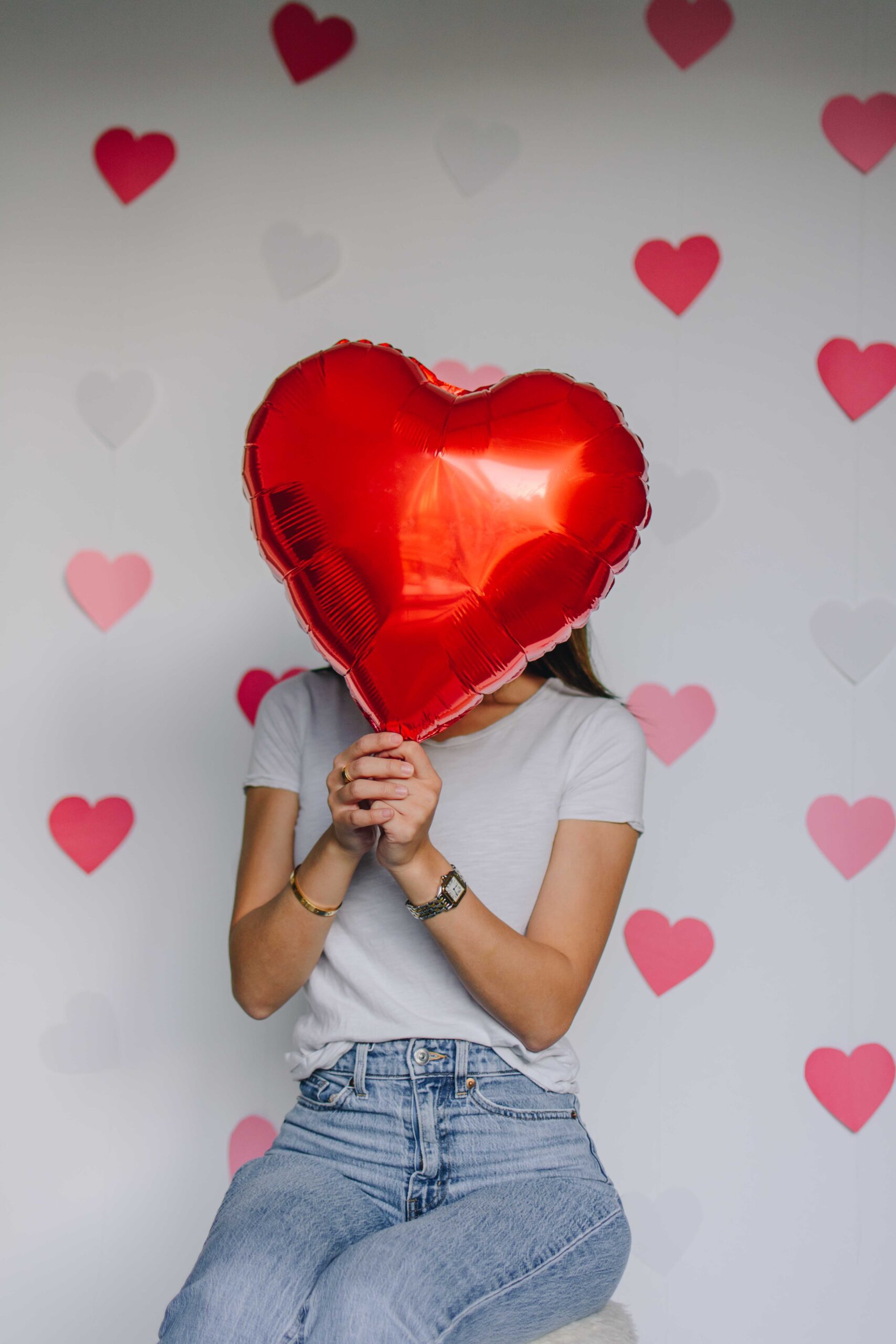 Arizona blogger Demi Bang does a Valentine's Day themed photoshoot with a red balloon.