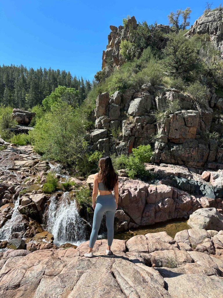 Arizona blogger Demi Bang hiking the Water Wheel Falls trail in Payson, Arizona.