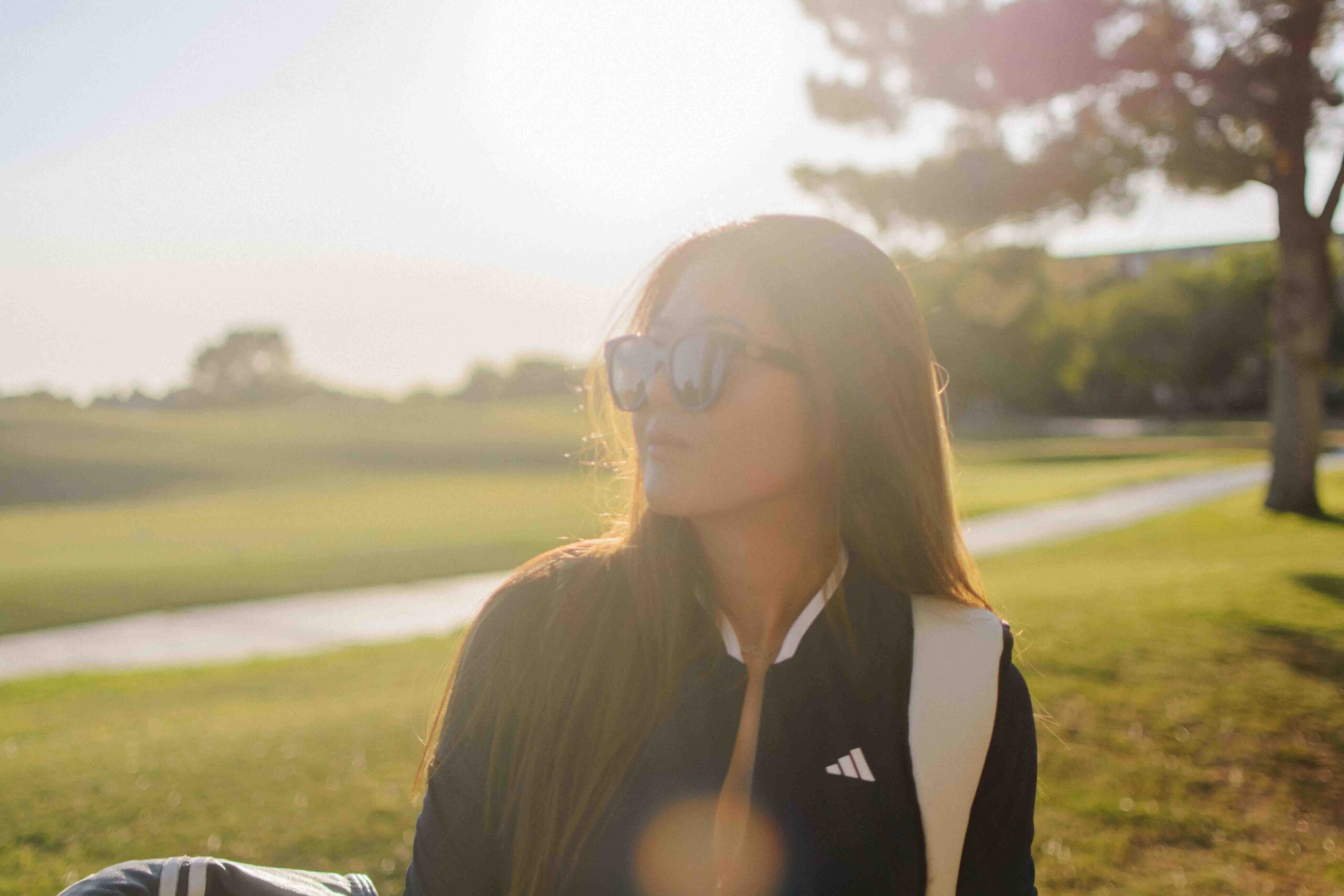 Demi Bang wearing adidas golfing clothes for women.