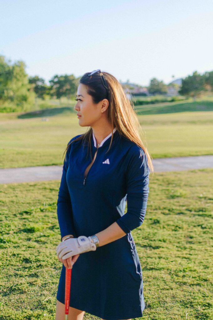 Lifestyle blogger Demi Bang wearing adidas long sleeve golf dress.