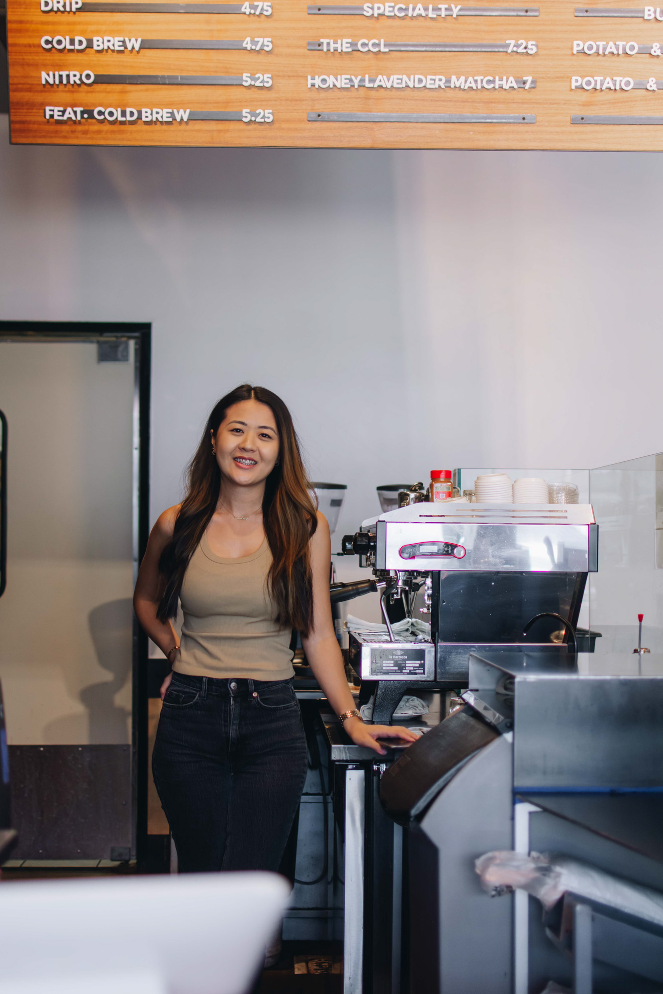 Arizona blogger Demi Bang being a barista at a specialty coffee shop.