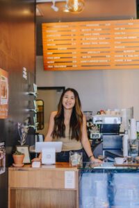 Arizona blogger Demi Bang working at a coffee shop.