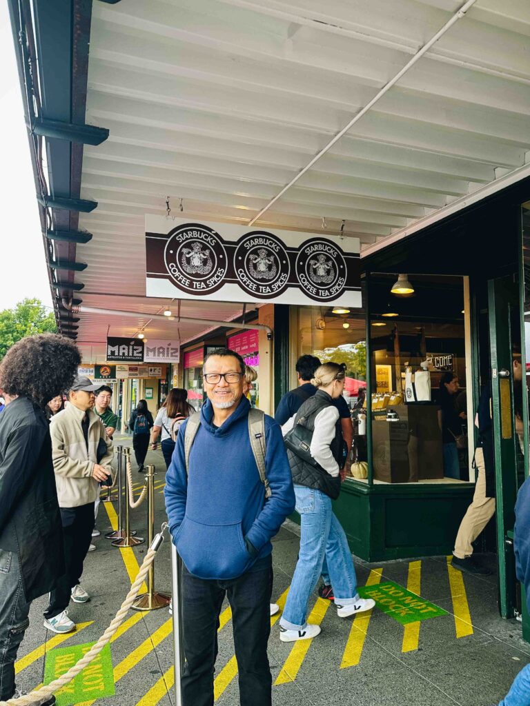 Visiting the first Starbucks location in Seattle, Washington.